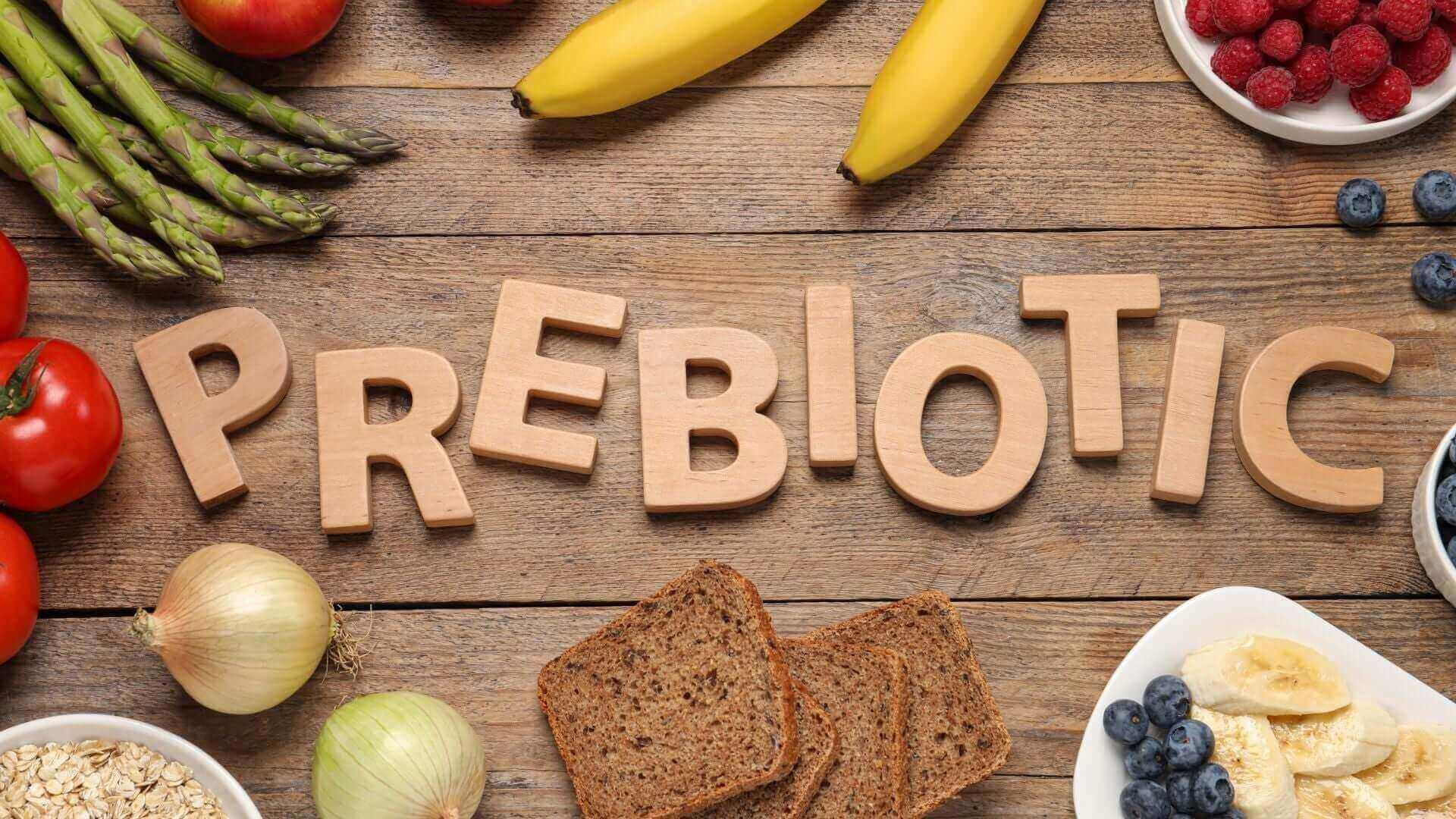 Prebiotic food examples including bananas, asparagus, onions, berries, tomatoes