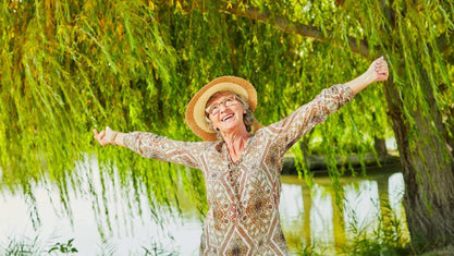 old woman full of energy with her arms spread 