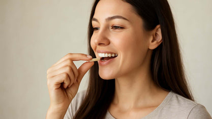 woman taking supplement capsule